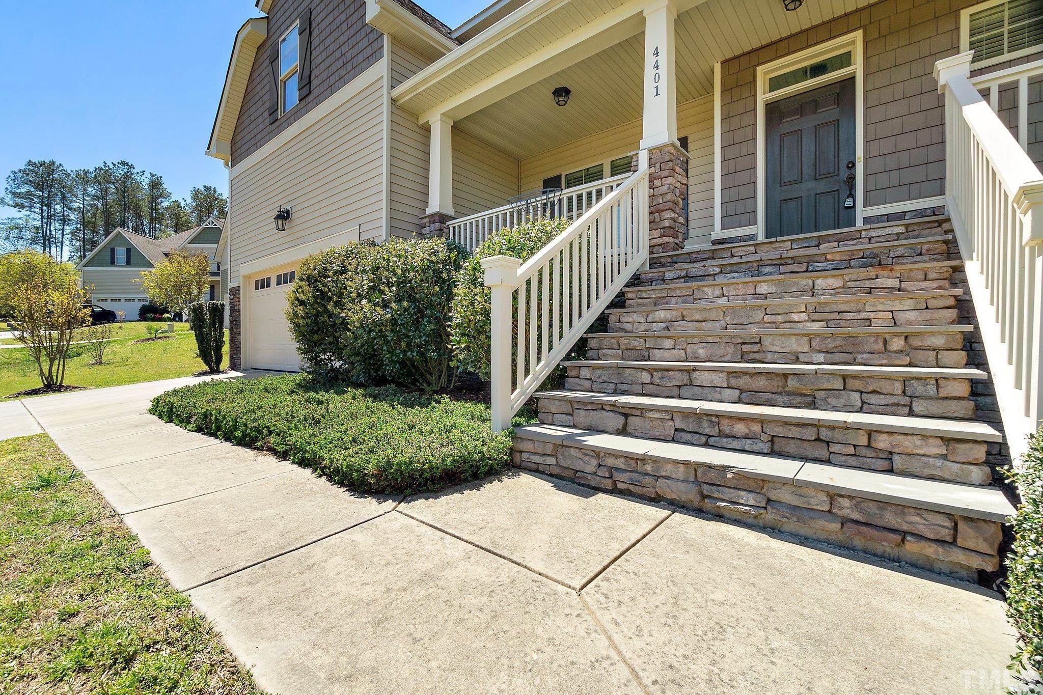 4401 Glengrove Road Raleigh, NC 27616 - Photo 5 of 26 a view of a house with a small yard and wooden floor and fence
