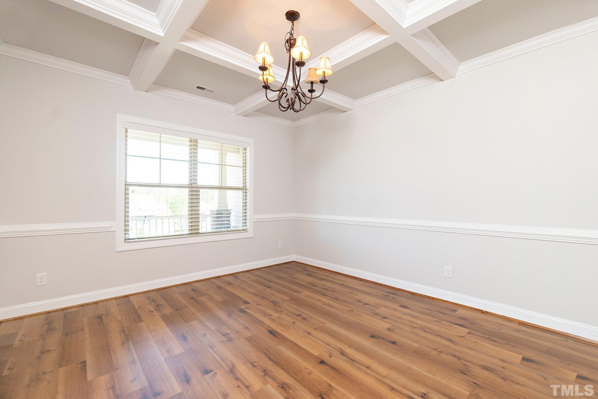 4401 Glengrove Road Raleigh, NC 27616 - Photo 8 of 26 wooden floor in an empty room with a window