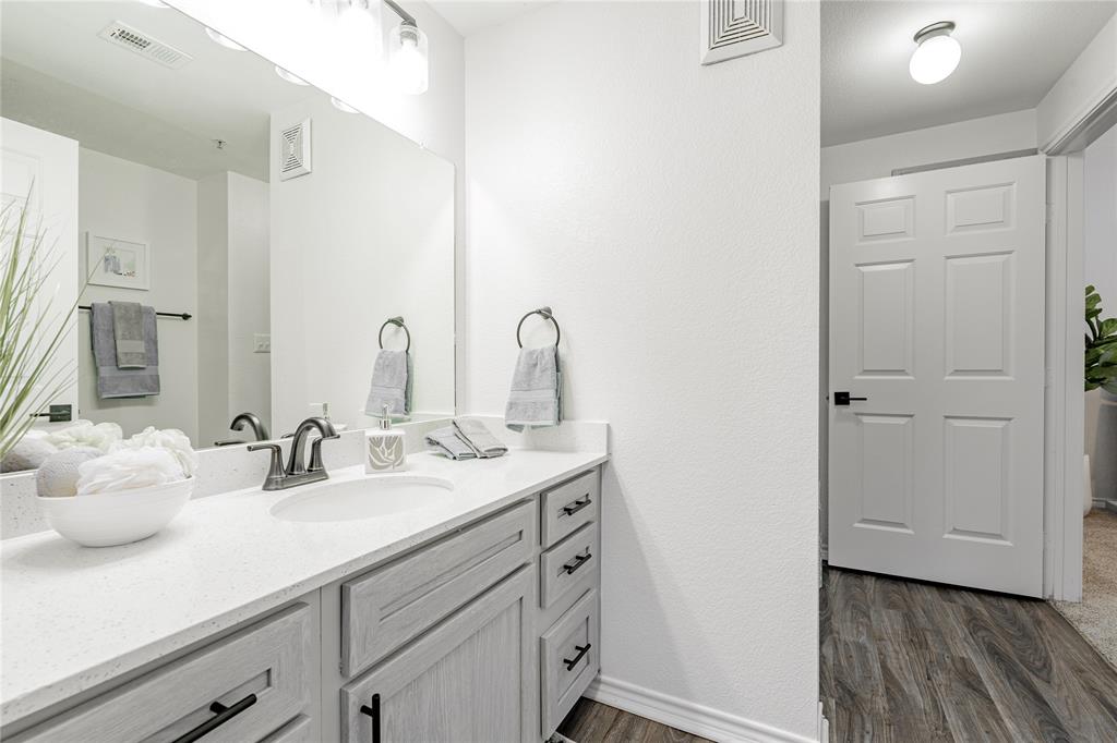 1600 North 9th Street, Unit A1R Midlothian, TX 76065 - Photo 3 of 15 a bathroom with a sink and a mirror