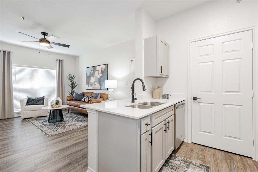 1600 North 9th Street, Unit A1R Midlothian, TX 76065 - Photo 5 of 15 a kitchen with a sink and cabinets
