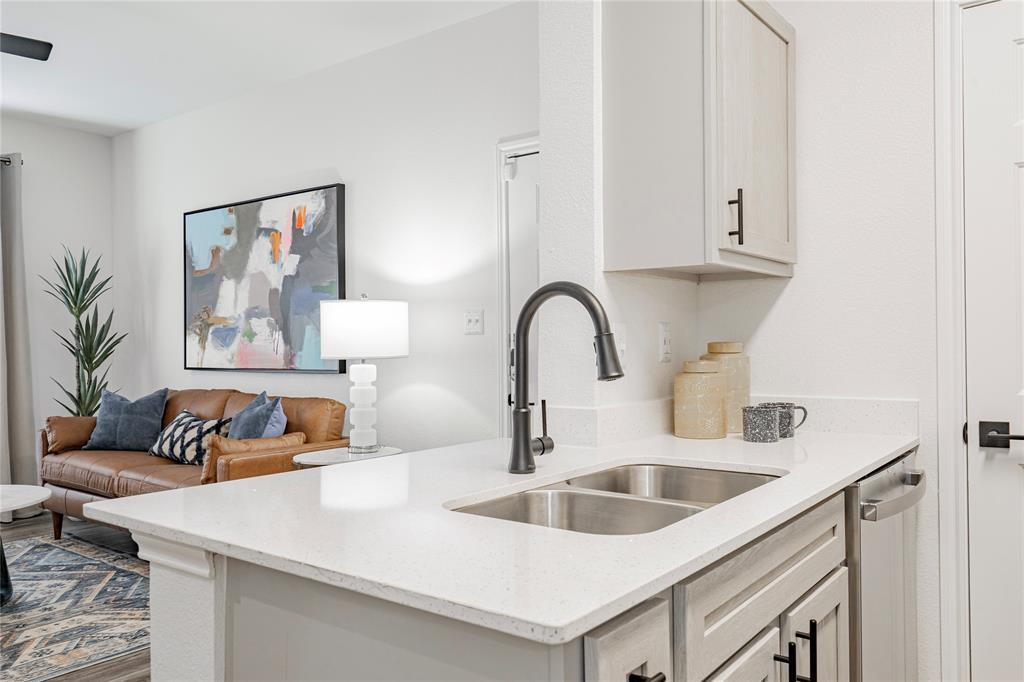 1600 North 9th Street, Unit A1R Midlothian, TX 76065 - Photo 6 of 15 a kitchen with a sink and cabinets