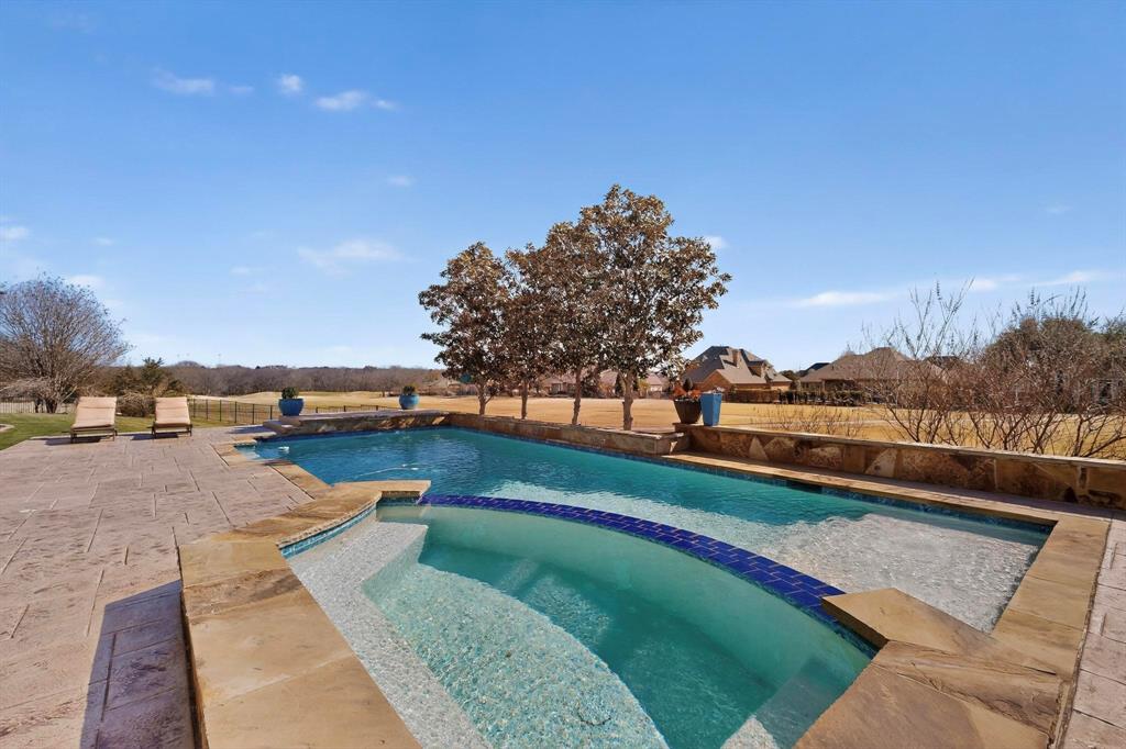 2108 Kyle Circle Heath, TX 75032 - Photo 27 of 40 Integrated pool / spa with a patio area and a fenced backyard
