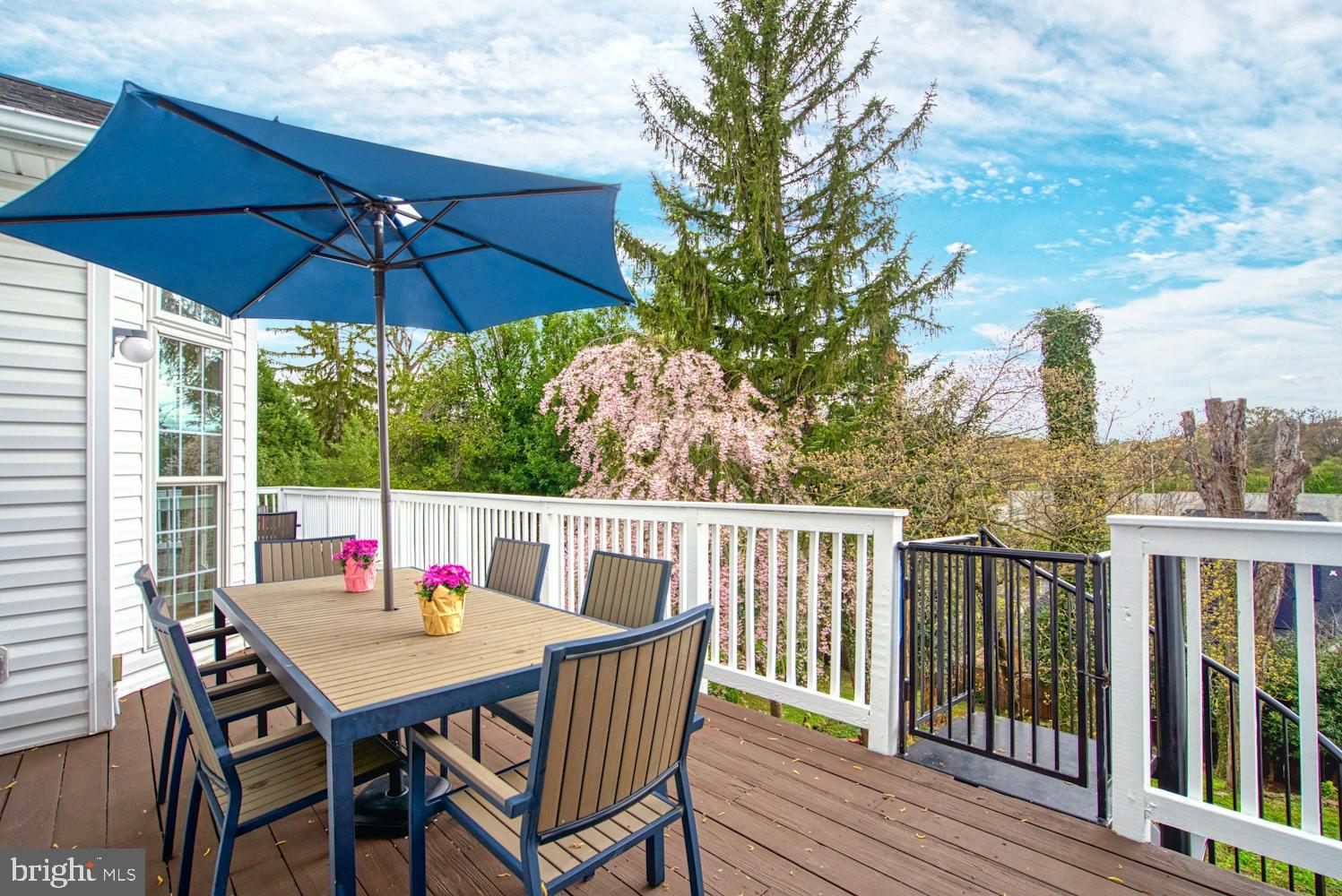 1702 South Arlington Ridge Road Arlington, VA 22202 - Photo 36 of 49 a view of balcony with furniture and umbrella