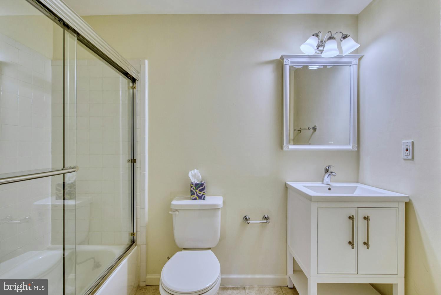 1702 South Arlington Ridge Road Arlington, VA 22202 - Photo 43 of 49 a bathroom with a sink toilet and shower