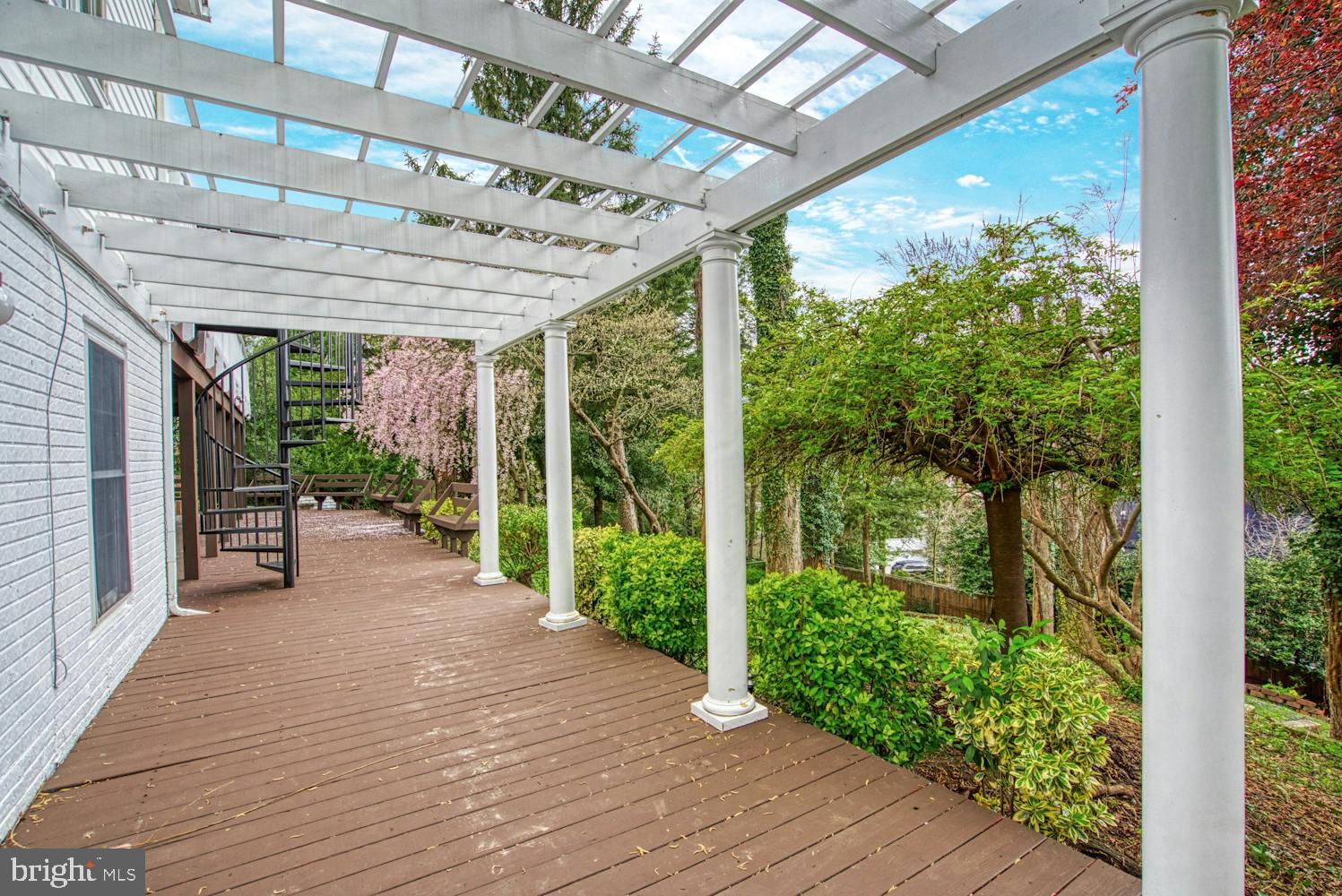 1702 South Arlington Ridge Road Arlington, VA 22202 - Photo 47 of 49 a porch with wooden floor and outdoor space