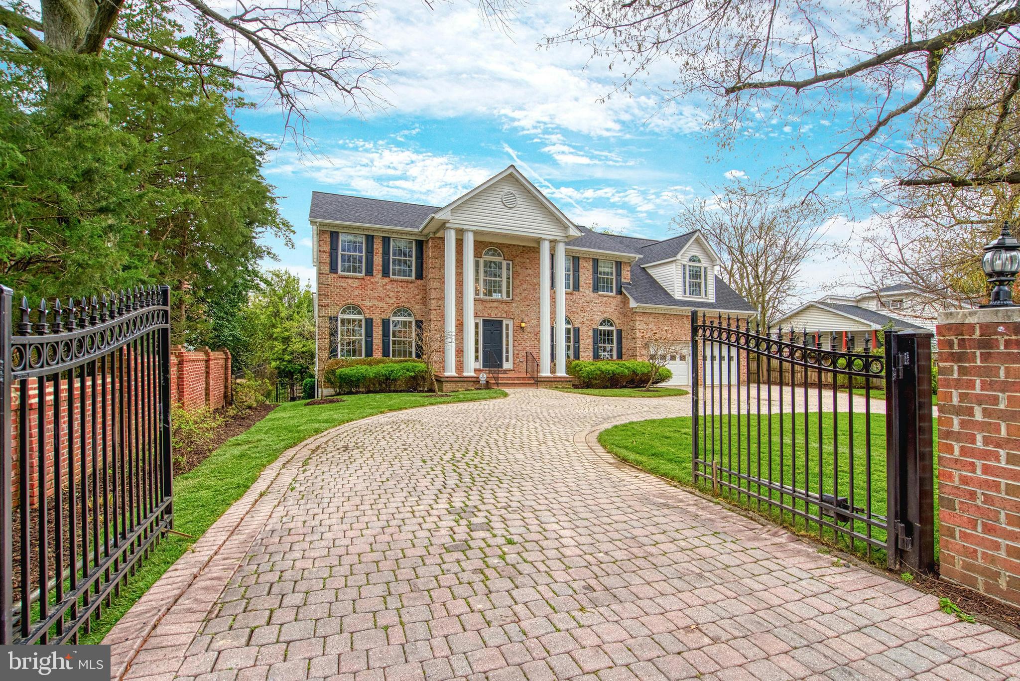 1702 South Arlington Ridge Road Arlington, VA 22202 - Photo 49 of 49 a front view of a house with a garden and pathway