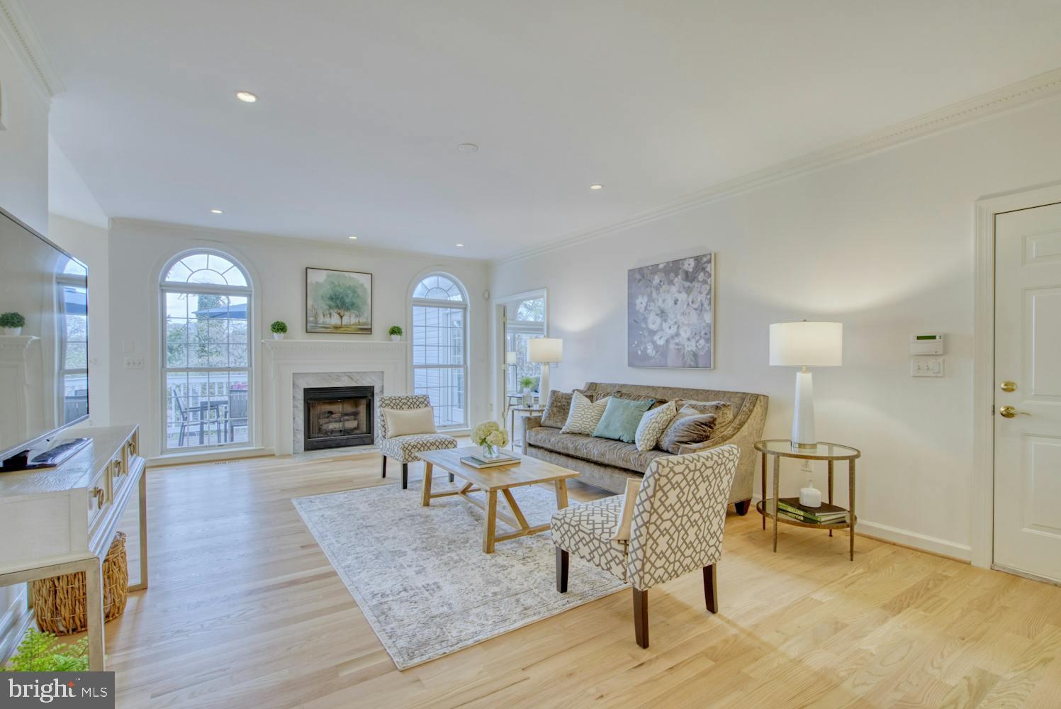 1702 South Arlington Ridge Road Arlington, VA 22202 - Photo 5 of 49 a living room with furniture and a fireplace
