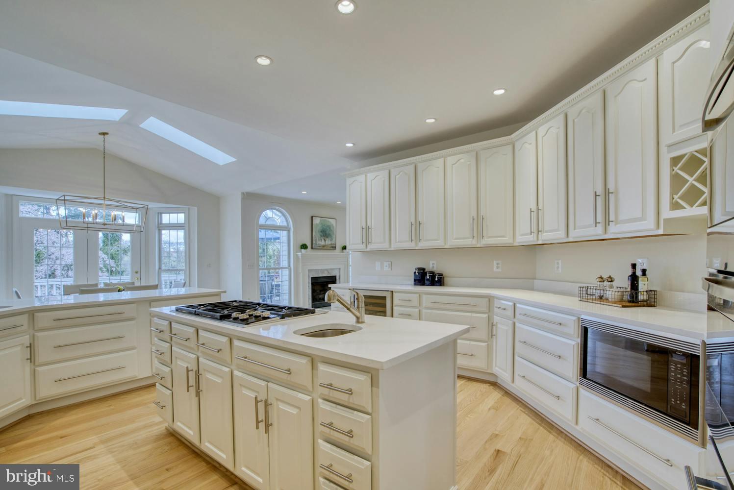 1702 South Arlington Ridge Road Arlington, VA 22202 - Photo 10 of 49 a kitchen with granite countertop a stove sink and cabinets