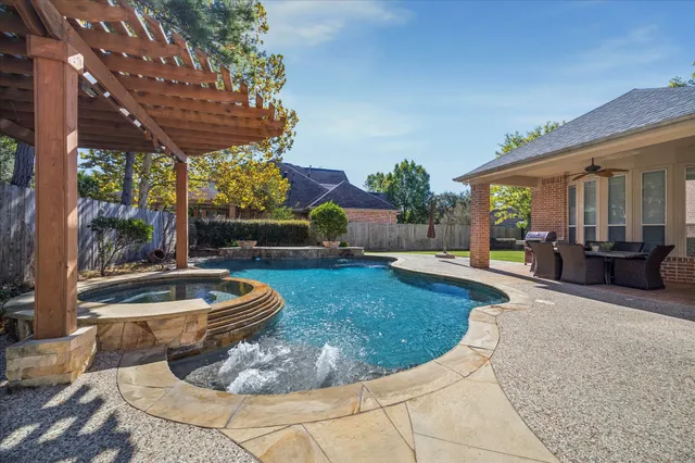 a view of a patio with table and chairs potted plants with sky view