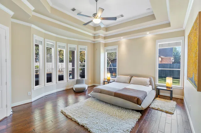 a spacious bathroom with a granite countertop tub sink and mirror