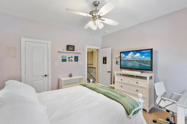 a utility room with dryer and book shelf