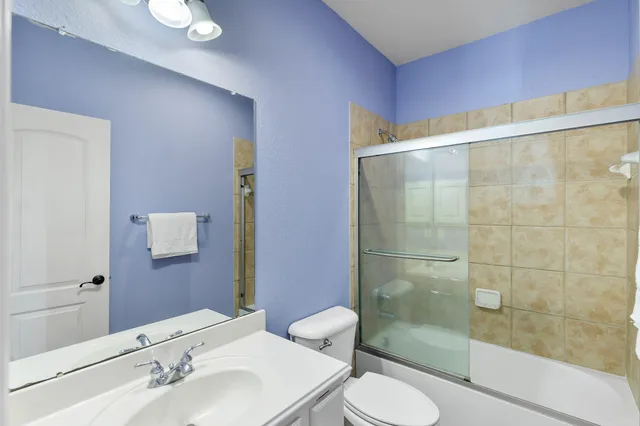 a living room with furniture and windows