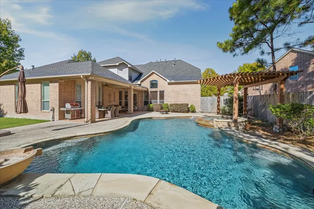 a view of a swimming pool with a patio
