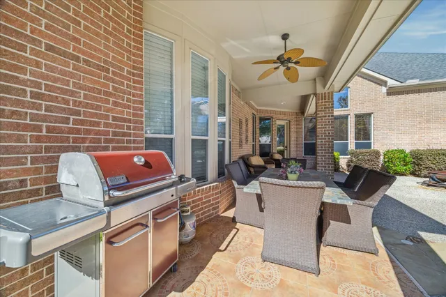an aerial view of a house with swimming pool and garden