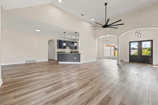 a bathroom with a granite countertop sink a toilet and vanity