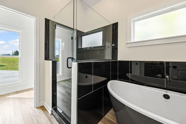 a bathroom with a granite countertop sink a toilet and vanity