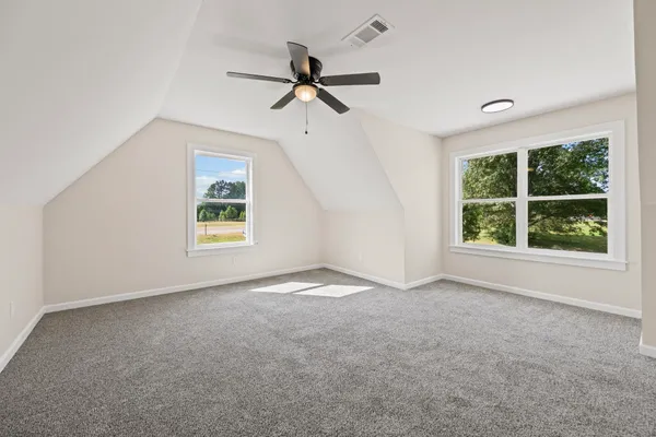 front view of a brick house with a large window