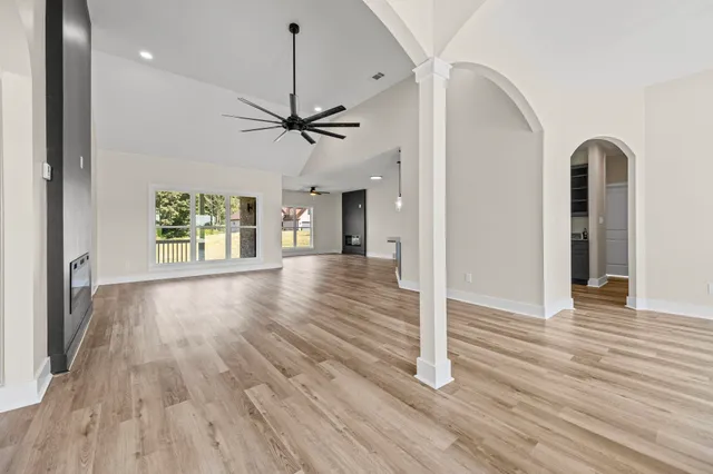 wooden floor in an empty room with a window
