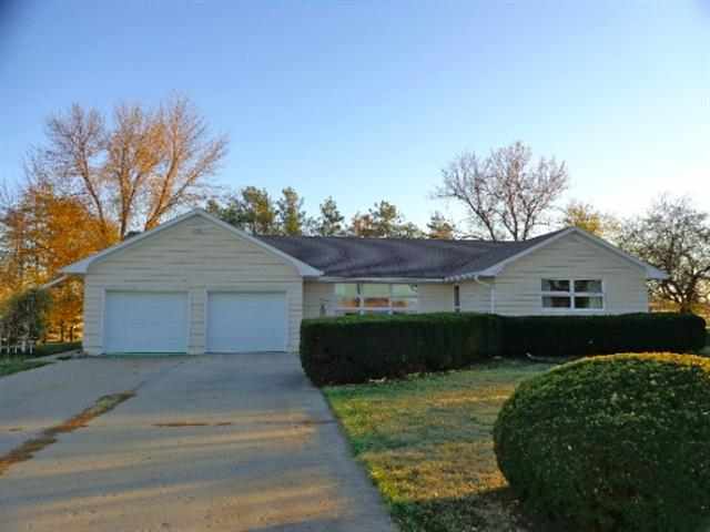 1076 West Becker School Road Freeport, IL 61032 - Photo 1 of 12 a front view of a house with a garden