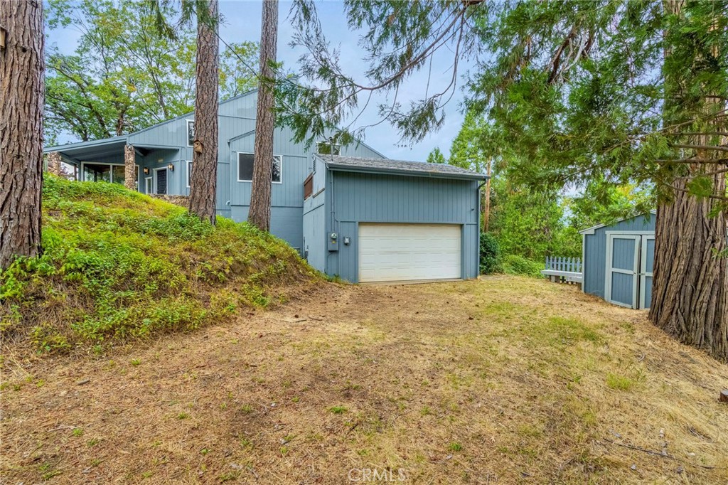 37068 Mudge Ranch Road Coarsegold, CA 93614 - Photo 35 of 53 a house with a trees in front of it