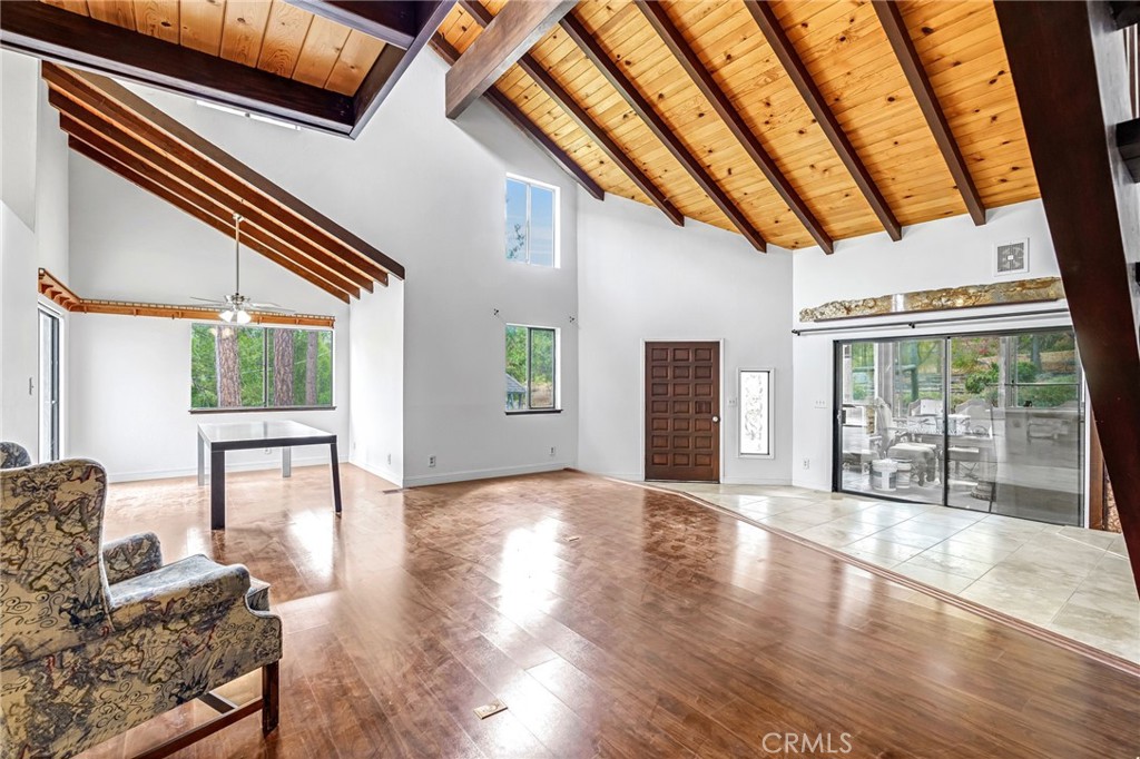 37068 Mudge Ranch Road Coarsegold, CA 93614 - Photo 7 of 53 a view of an empty room with wooden floor and a window