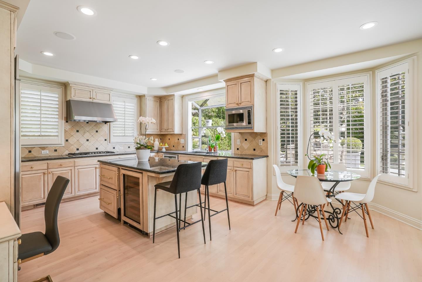 75 Riordan Place Menlo Park, CA 94025 - Photo 12 of 55 a kitchen with a table chairs a sink dishwasher window and cabinets