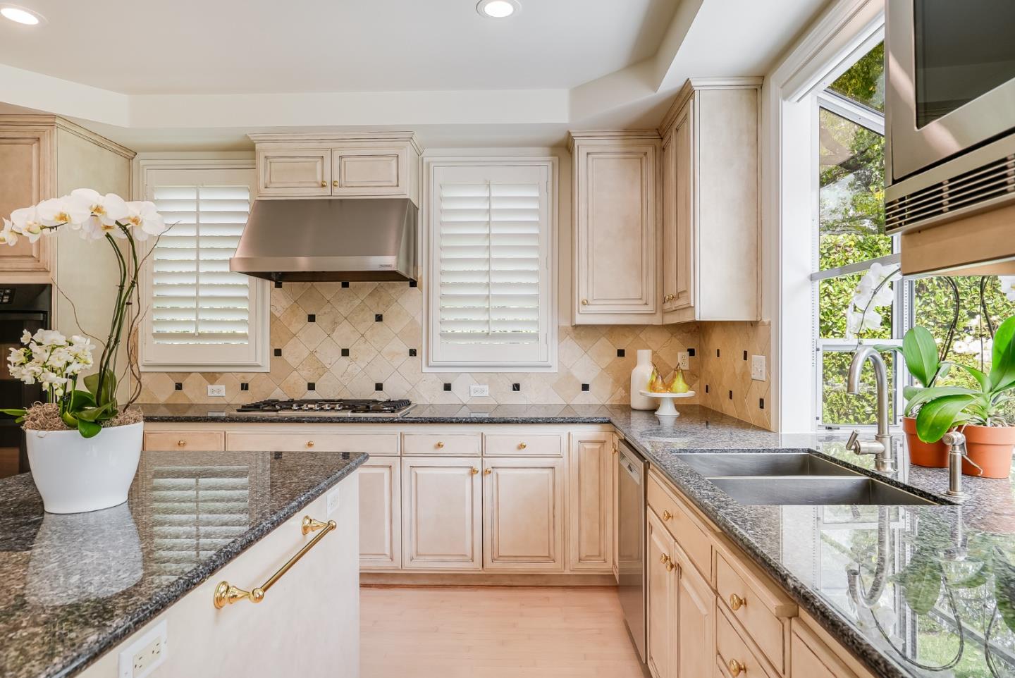 75 Riordan Place Menlo Park, CA 94025 - Photo 16 of 55 a kitchen with stainless steel appliances granite countertop a sink a stove and cabinets