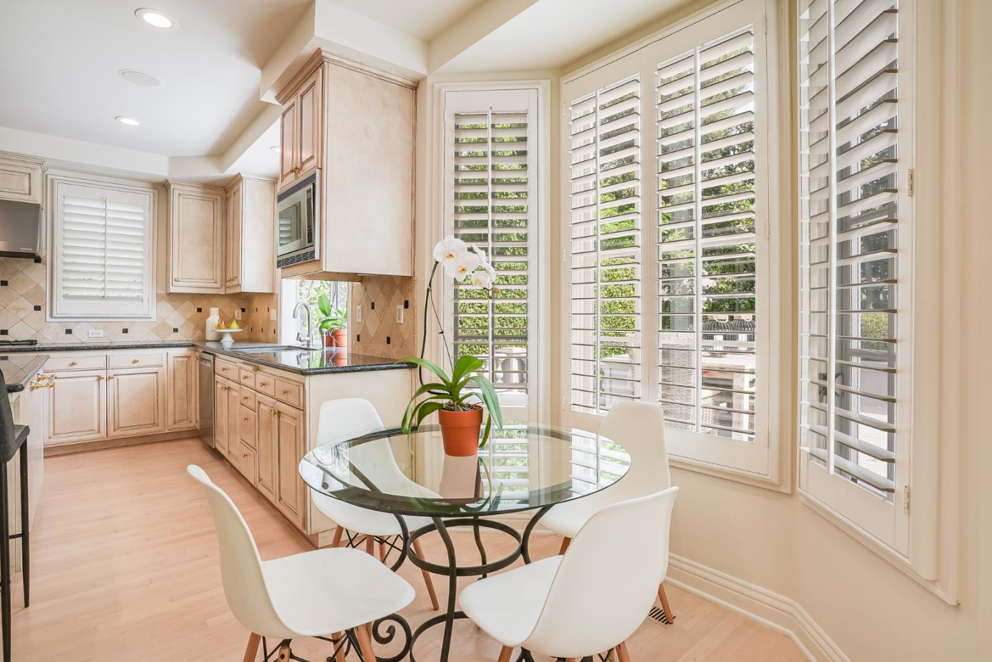 75 Riordan Place Menlo Park, CA 94025 - Photo 17 of 55 a kitchen with a table chairs sink and cabinets