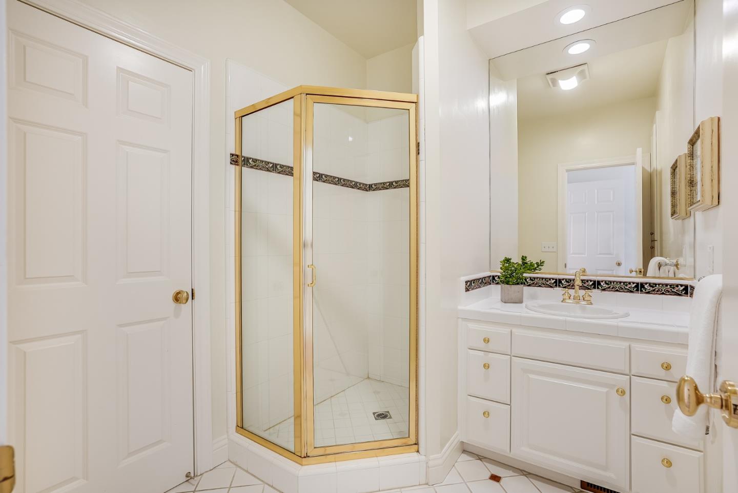 75 Riordan Place Menlo Park, CA 94025 - Photo 23 of 55 a bathroom with a shower sink and mirror