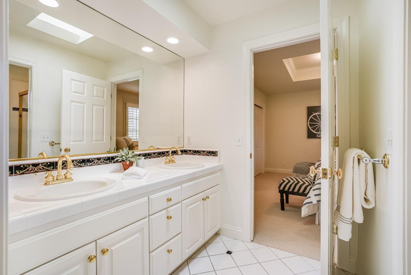 75 Riordan Place Menlo Park, CA 94025 - Photo 28 of 55 a bathroom with a double vanity sink a mirror and a shower