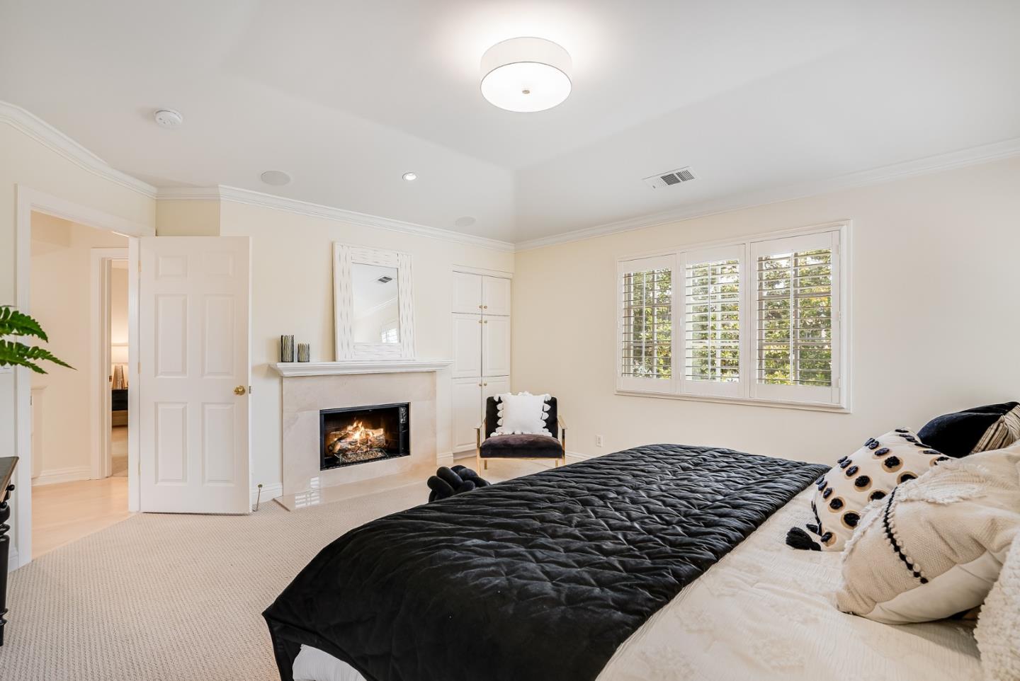 75 Riordan Place Menlo Park, CA 94025 - Photo 33 of 55 a bedroom with bed and a fireplace