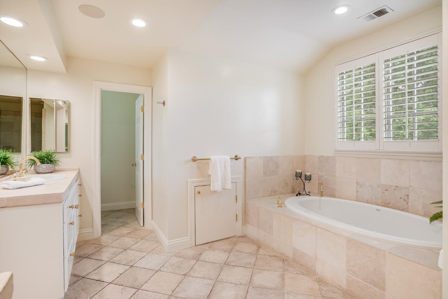 75 Riordan Place Menlo Park, CA 94025 - Photo 37 of 55 a spacious bathroom with a tub sink and mirror