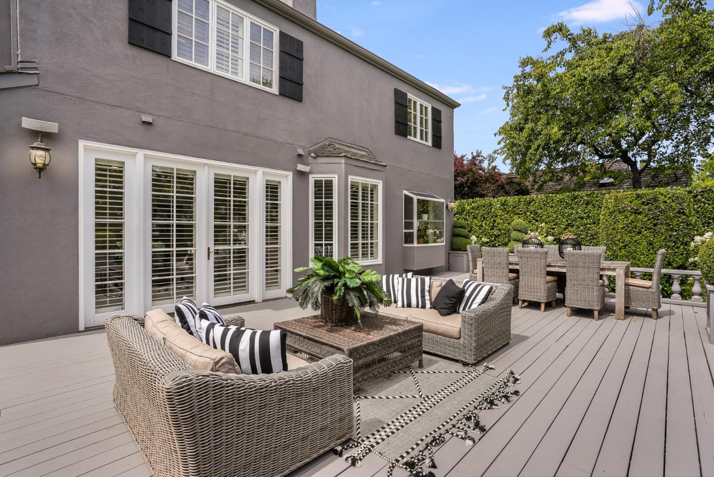 75 Riordan Place Menlo Park, CA 94025 - Photo 47 of 55 a view of a patio with couches chairs potted plants and wooden floor