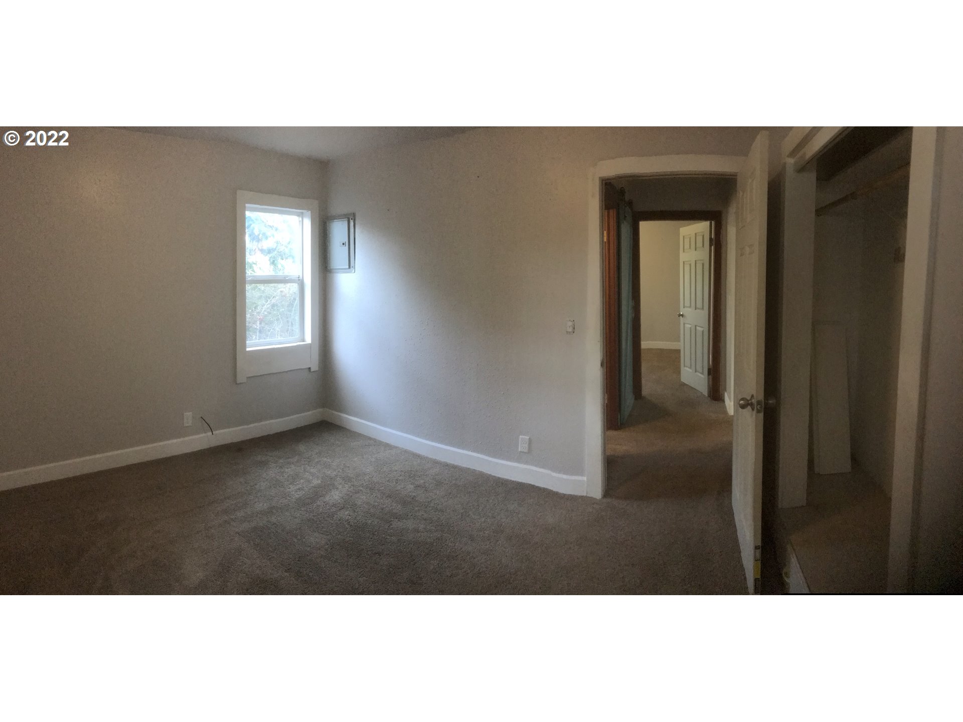 1470 Waite Street Eugene, OR 97402 - Photo 16 of 20 a view of an empty room with wooden floor and a window