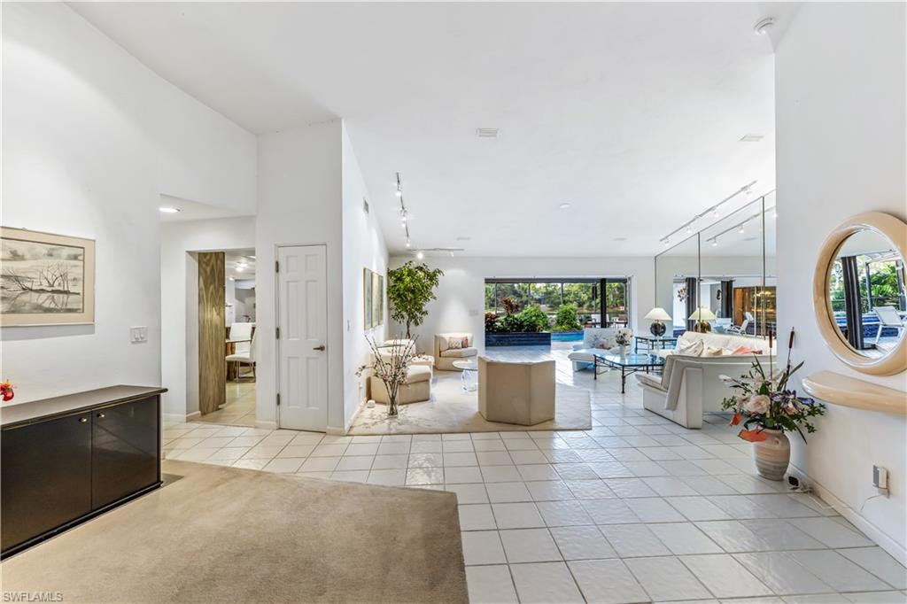 550 Bald Eagle Drive Naples, FL 34105 - Photo 11 of 37 a view of living room and patio