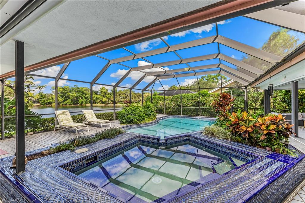 550 Bald Eagle Drive Naples, FL 34105 - Photo 29 of 37 a view of a backyard with sitting area