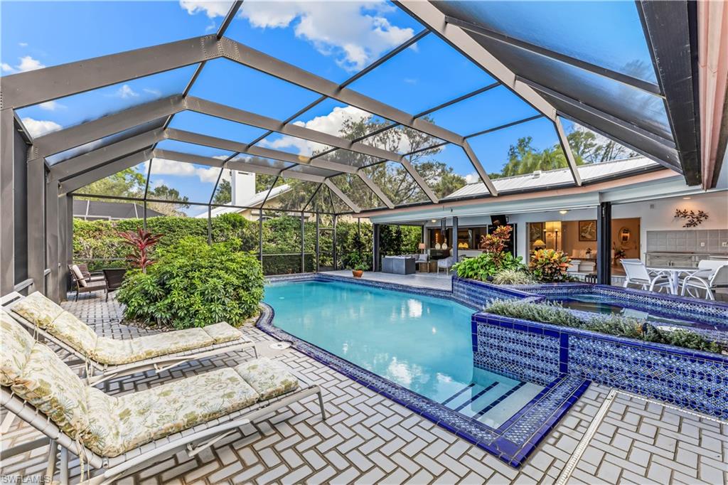 550 Bald Eagle Drive Naples, FL 34105 - Photo 30 of 37 a view of a chairs and table in the patio