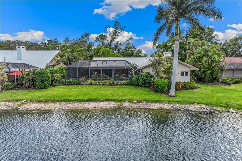 550 Bald Eagle Drive Naples, FL 34105 - Photo 36 of 37 a view of a house with a yard