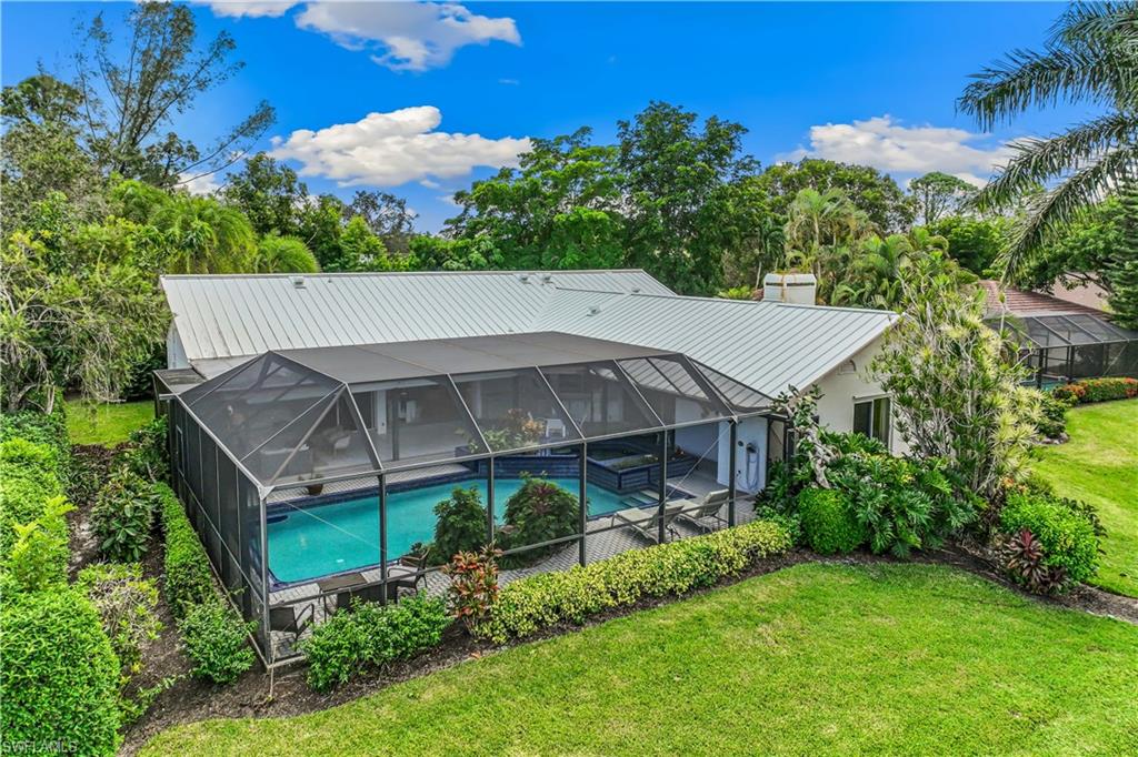 550 Bald Eagle Drive Naples, FL 34105 - Photo 37 of 37 an aerial view of a house with a big yard