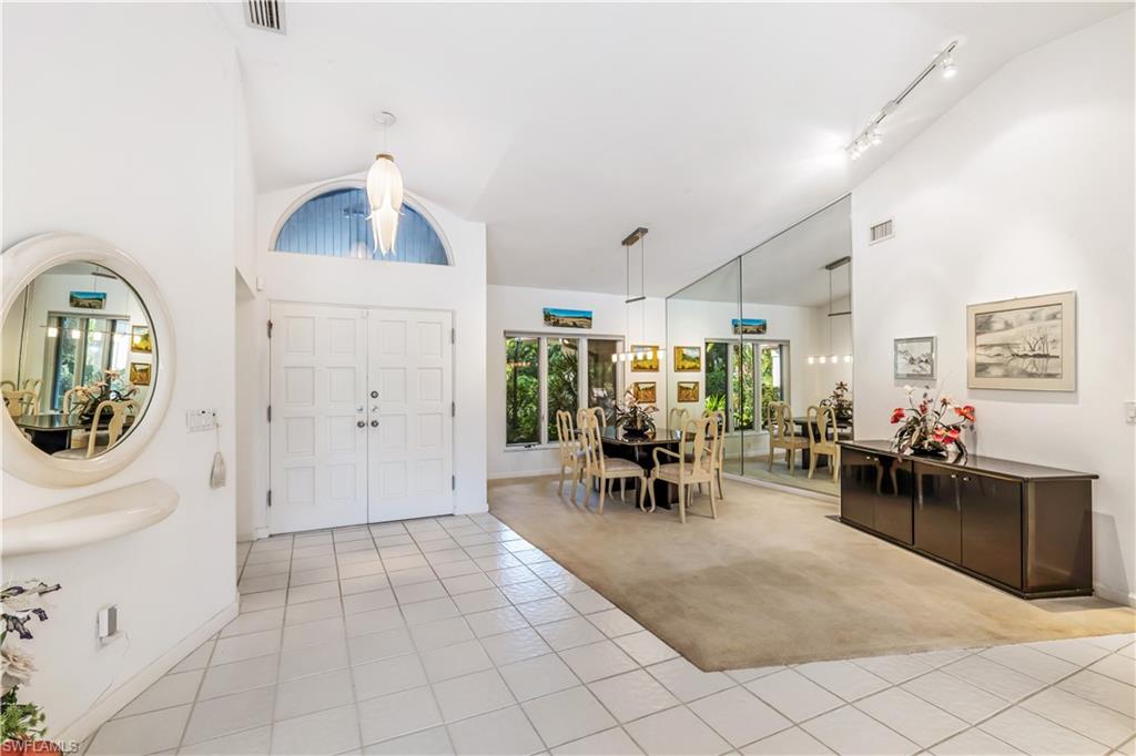 550 Bald Eagle Drive Naples, FL 34105 - Photo 5 of 37 a view of a livingroom with furniture and a window
