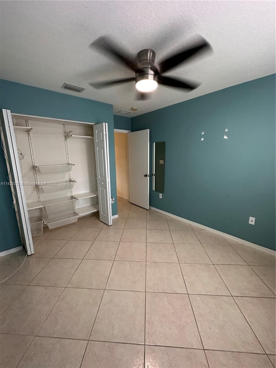 1041 Southeast 20th Road Homestead, FL 33035 - Photo 11 of 40 a view of an empty room with a window
