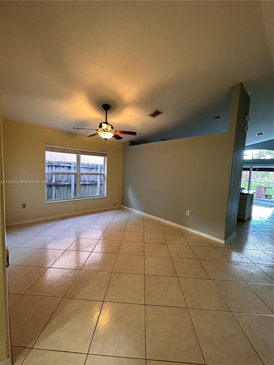 1041 Southeast 20th Road Homestead, FL 33035 - Photo 12 of 40 a view of an empty room and window