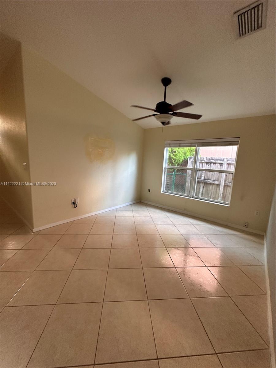 1041 Southeast 20th Road Homestead, FL 33035 - Photo 13 of 40 a view of an empty room and window