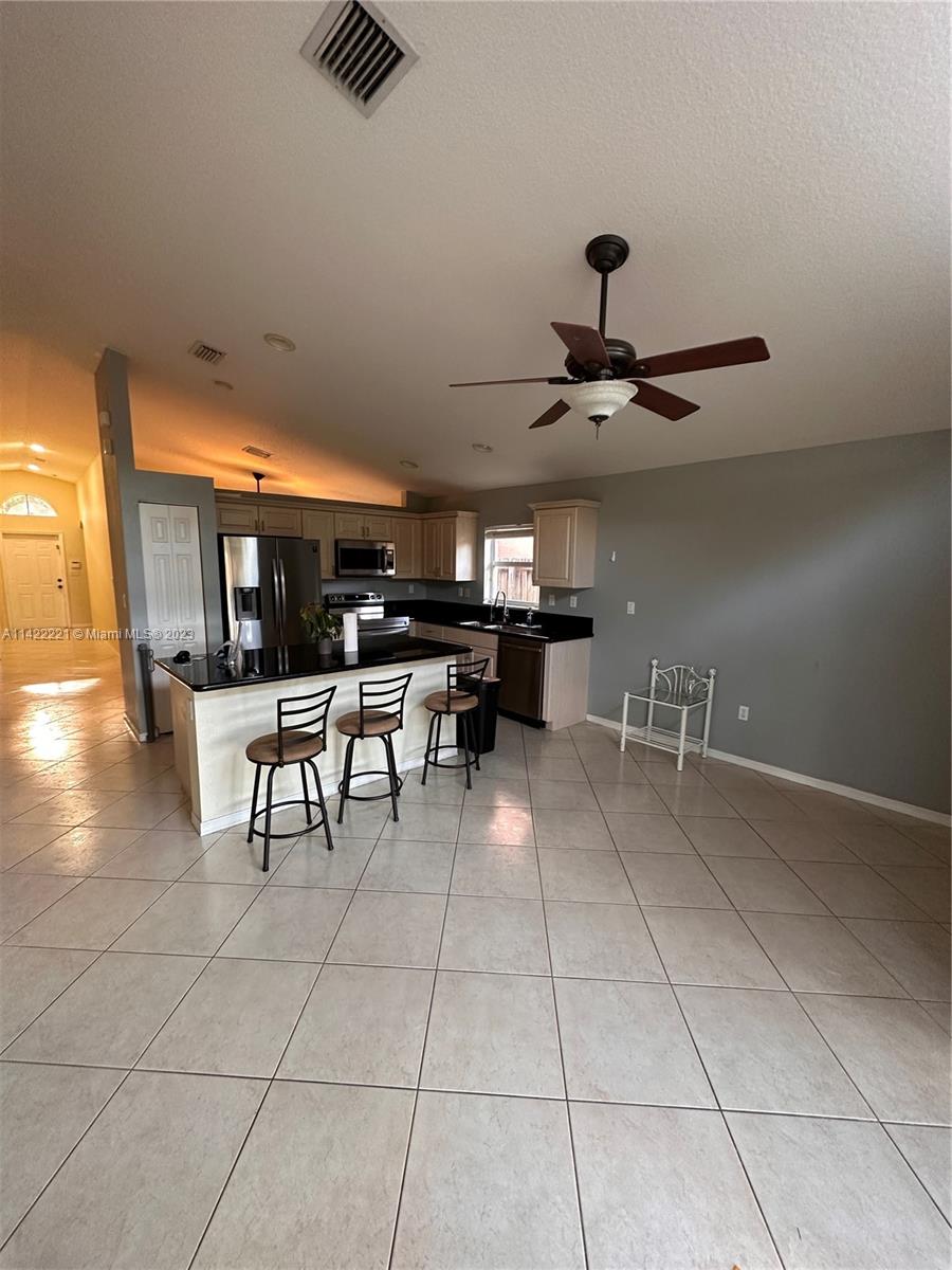 1041 Southeast 20th Road Homestead, FL 33035 - Photo 21 of 40 a view of a room with gym equipment