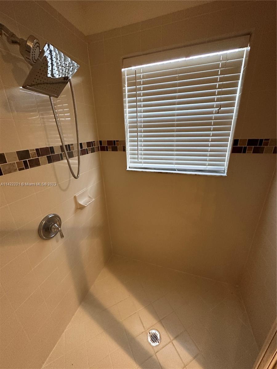 1041 Southeast 20th Road Homestead, FL 33035 - Photo 24 of 40 a bathroom with a shower
