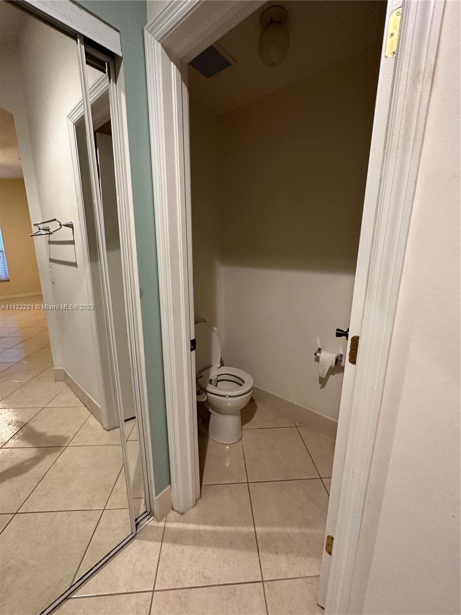 1041 Southeast 20th Road Homestead, FL 33035 - Photo 27 of 40 a bathroom with a sink and a mirror
