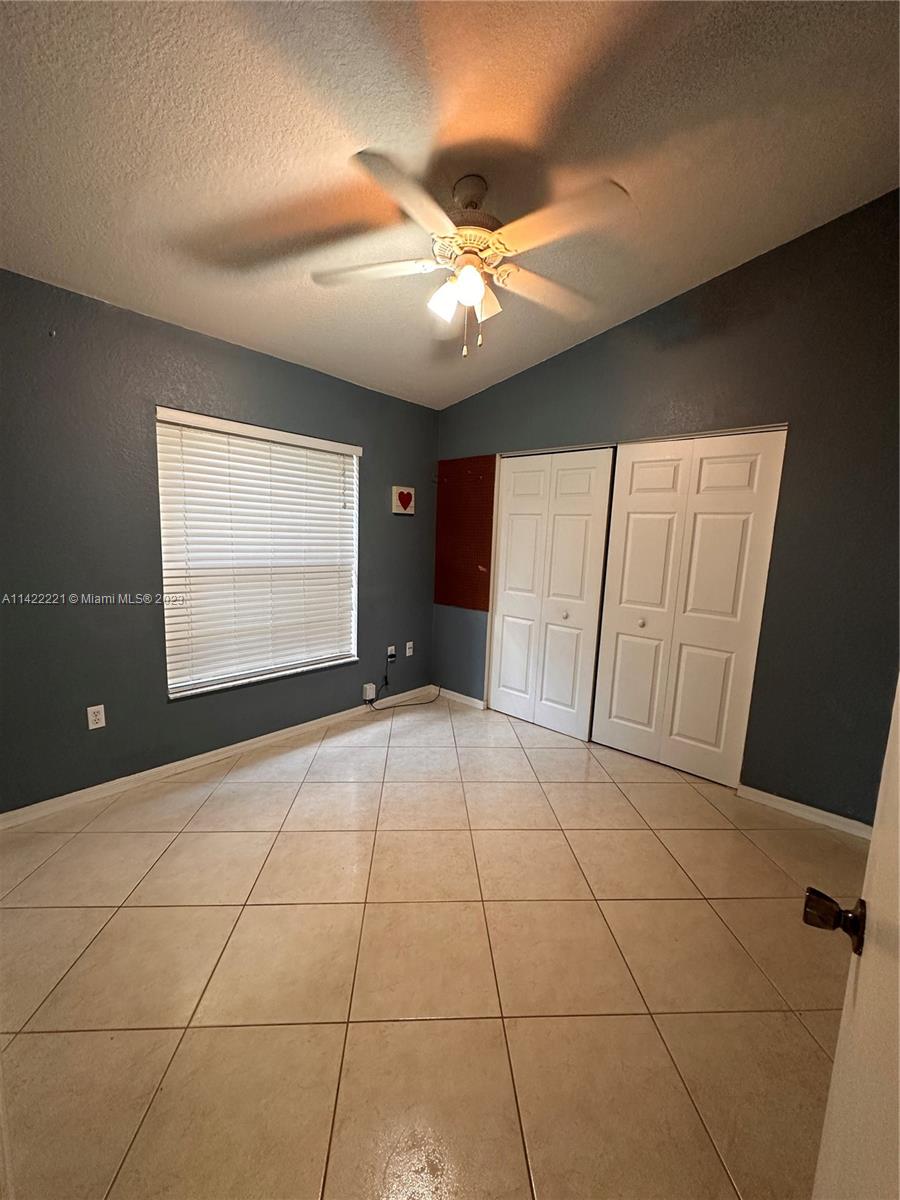 1041 Southeast 20th Road Homestead, FL 33035 - Photo 28 of 40 a view of an empty room with a window
