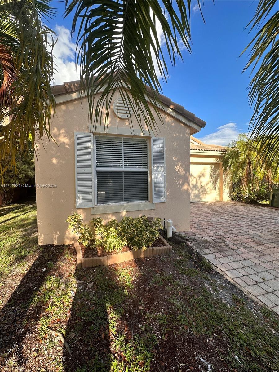 1041 Southeast 20th Road Homestead, FL 33035 - Photo 3 of 40 a front view of house with yard