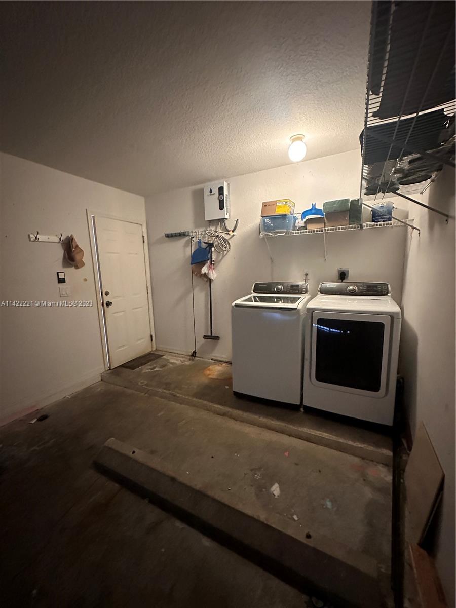 1041 Southeast 20th Road Homestead, FL 33035 - Photo 36 of 40 a utility room with dryer and washer