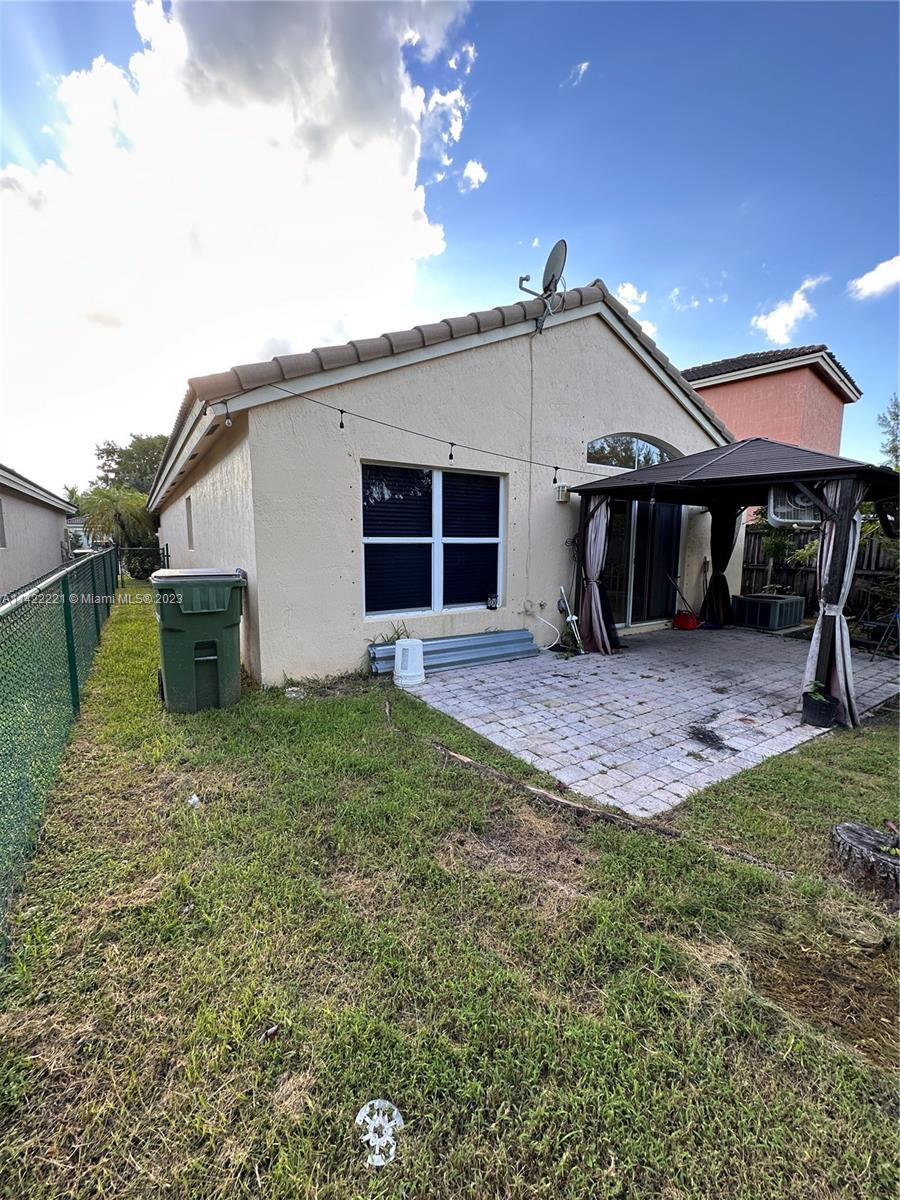 1041 Southeast 20th Road Homestead, FL 33035 - Photo 37 of 40 a view of a house with a backyard